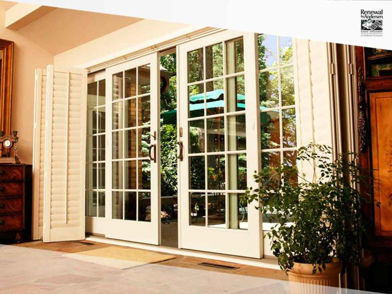 White french doors partially open leading to outside.