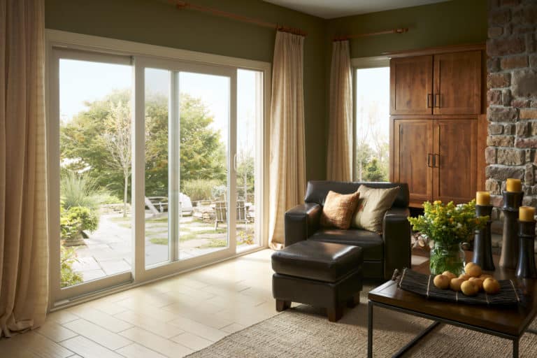 Wide sliding glass doors with a white frame.