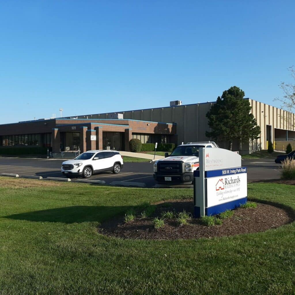 Our Carol Stream, IL location. Large warehouse building with a brown brick entry way.