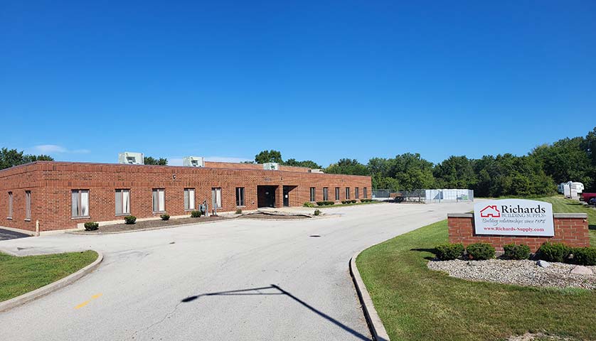Richard Building Supply in Calumet City, IL. Wide brown brick building with a large parking lot