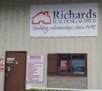 Richards Building Supply in Fayetteville, NC. Single story beige metal building.