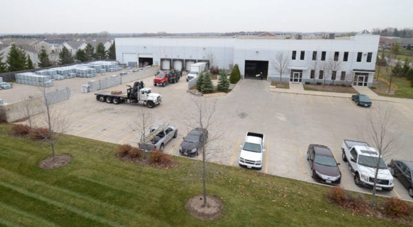 Richards Building Supply in Lindenhurst, IL. Large, 2 story gray and white building.