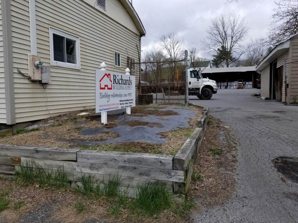 Richards Building Supply in Middleton, NY. Single story beige building.