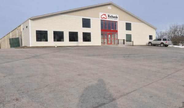 Richards Building Supply in Oswego, IL. Large beige metal building.