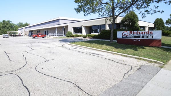 Richards Building Supply in West Allis, WI. Single story white building.