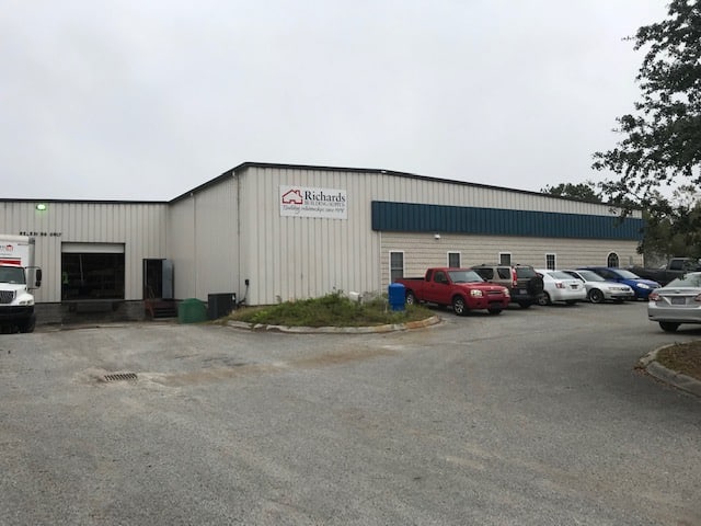 Richards Building Supply in Wilmington, NC. Single story white metal building.