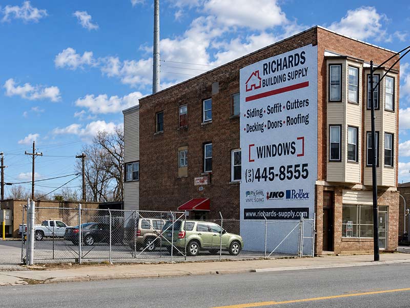 Richards Building Supply at 111 St. in Chicago. Three story building, large Richards sign and parking lot