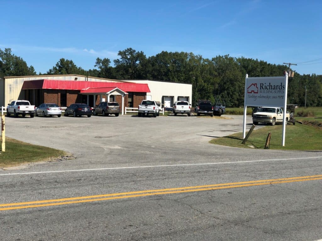 Richards Building Supply in Winterville, NC. Single story brick and metal building.