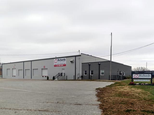 Rock Island location photo. Grey building with parking lot and Richards sign in front.
