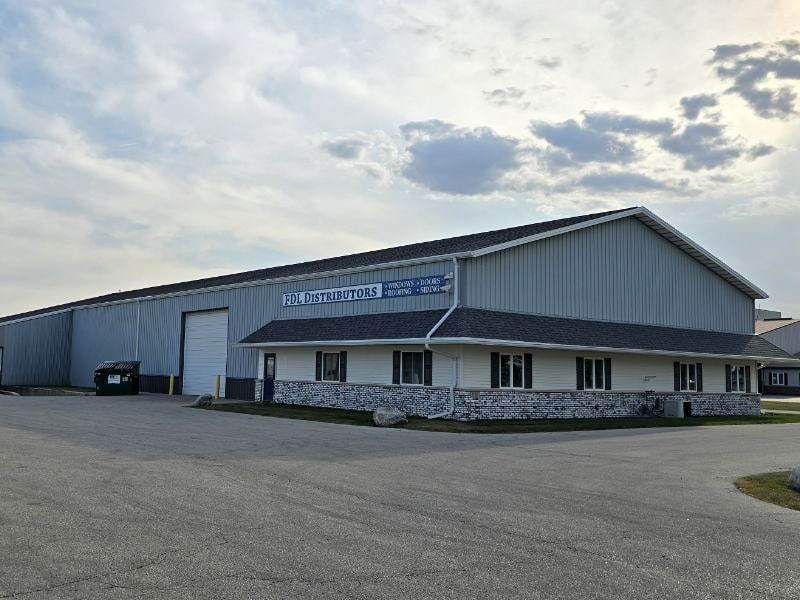 Richards Building Supply in Fond Du Lac, WI. Light grey metal building.